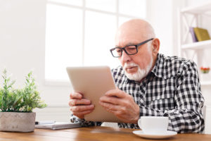 Salt-Manage-Senior-Online-Elderly-Man-On-Tablet