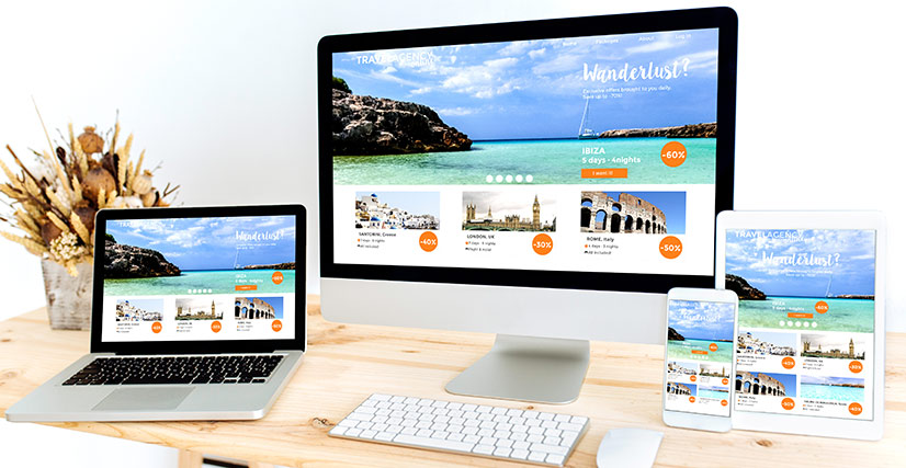 Desktop, laptop, tablet and smartphone all showing website design for travel website